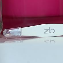 ZB white aloha slant tweezer with tip guard on bathroom counter