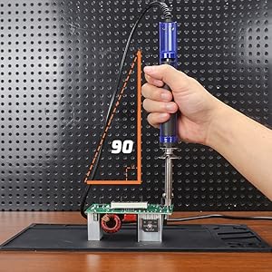 A man places WEP 929D-V vertically to the component to desoldering different components.