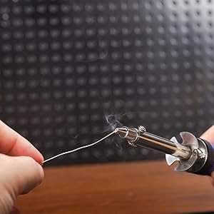 A man tin the desoldering nozzle of WEP 929D-V with solder