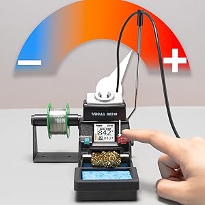 A man is adjusting temperature of the YIHUA 982-III precision soldering station